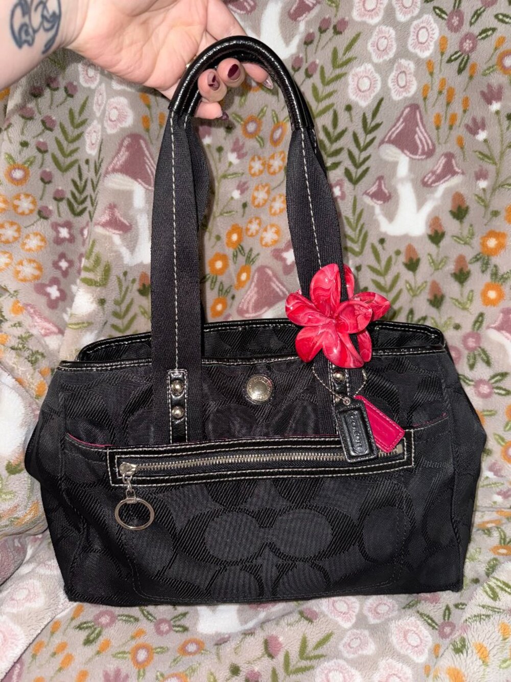 Black w/pink interior Coach Daisy Signature tote bag